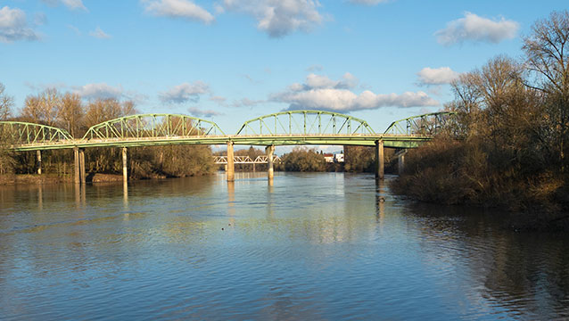 A view of a bridge over a river. Find out how to contact the Albany, Oregon, office of Harder, Wells, Baron and Manning.